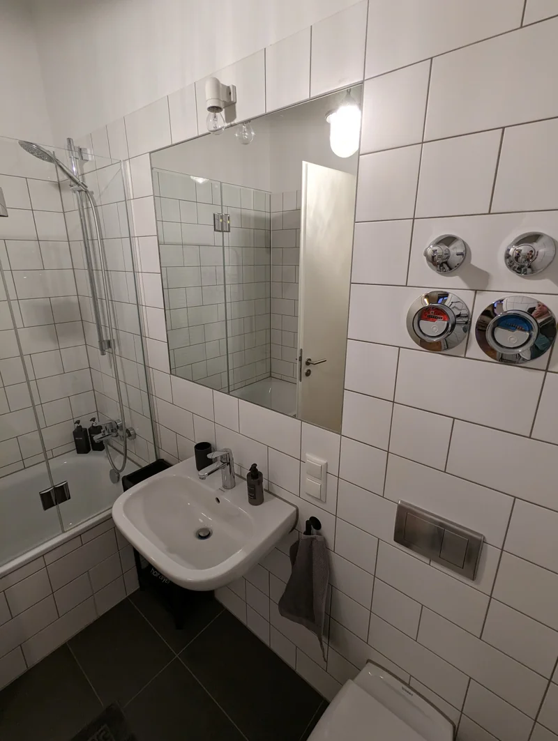 Tiled bathroom with bathtub